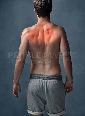 Buy stock photo Red highlight, back pain and man with fitness, inflammation and muscle tension on gray studio background. Person, athlete or model with exercise, injury or joint ache with medical problem or accident