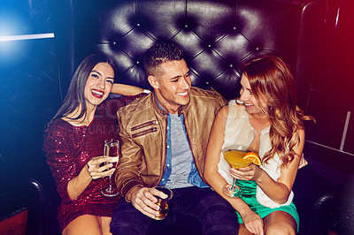 Buy stock photo Friends, club and party drinking alcohol at disco event, concert or happy hour for new years celebration together. Man and women with smile relaxing, clubbing and having fun at rave or nightclub