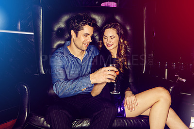 Buy stock photo Happy couple, toast or smile in nightclub with cocktails, drinks or champagne for vip event, birthday or date. People, man or excited woman in dark disco party couch or alcohol, cheers or celebration