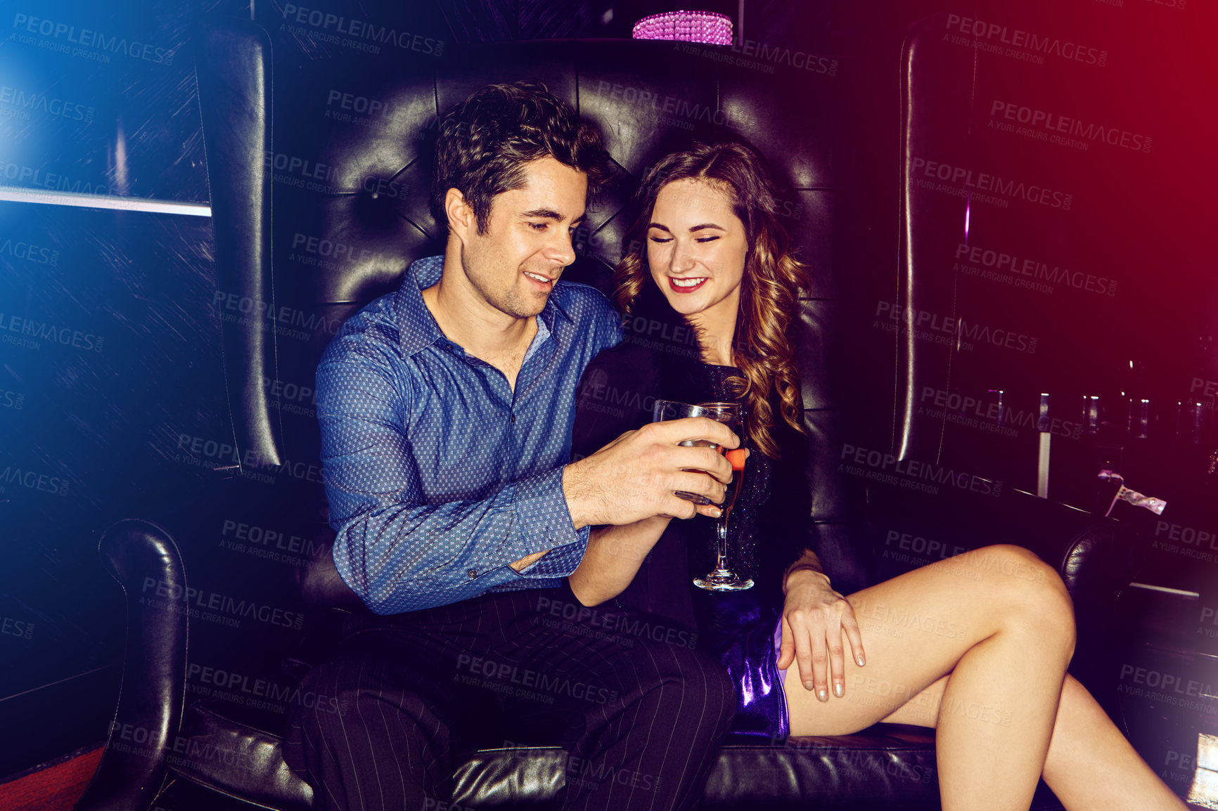 Buy stock photo Happy couple, toast or smile in nightclub with cocktails, drinks or champagne for vip event, birthday or date. People, man or excited woman in dark disco party couch or alcohol, cheers or celebration