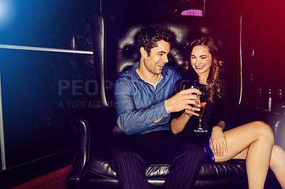 Buy stock photo Happy couple, cheers or smile in nightclub with cocktails, drinks or champagne for vip event, memory or date. People, man or excited woman in dark disco party couch for alcohol, toast or celebration