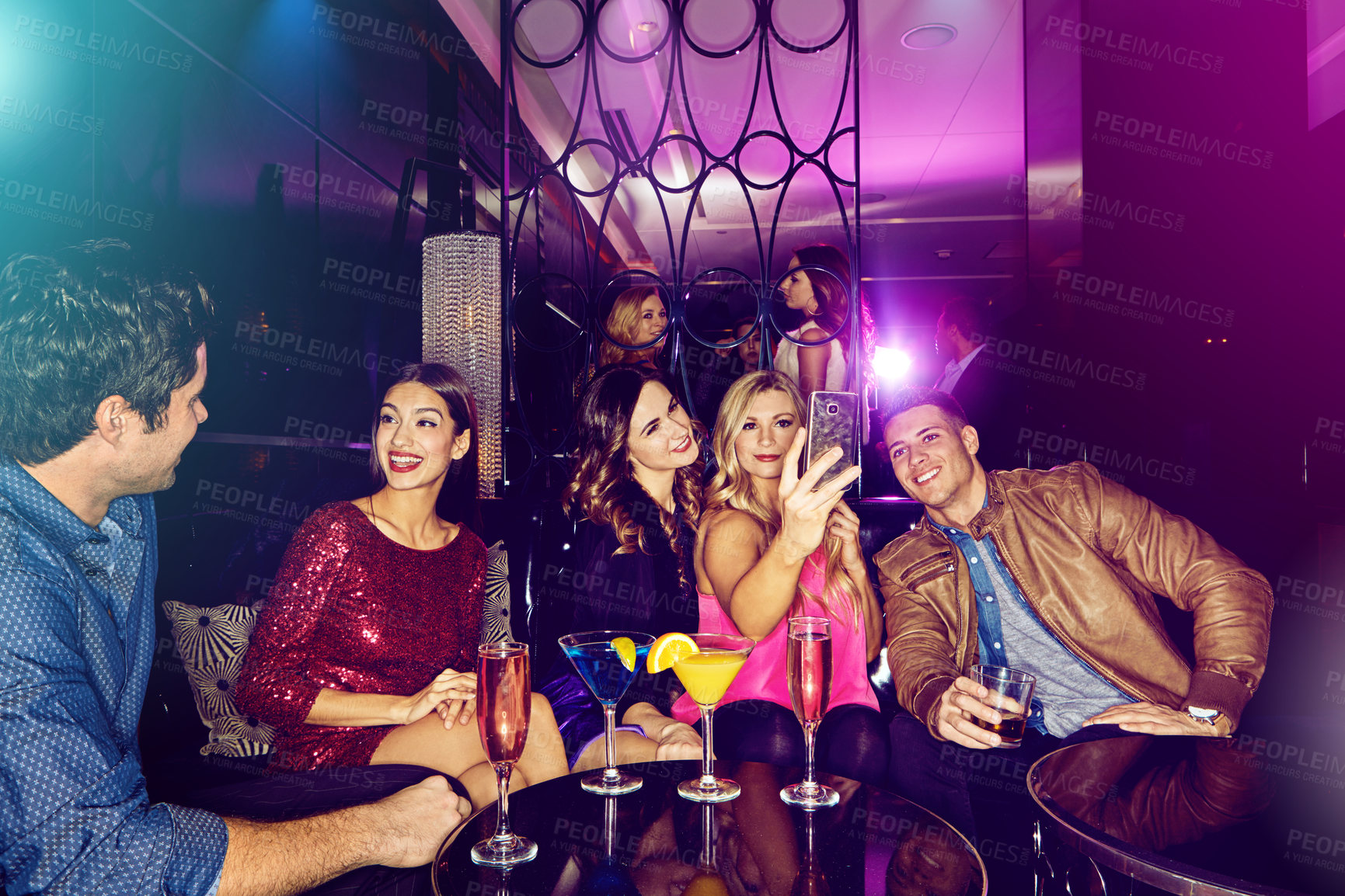 Buy stock photo Friends group, nightclub selfie and phone for celebration, party and sitting on couch in night. Club cocktail, conversation and happy smartphone picture for social media, memory or new year in disco