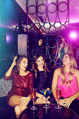 Buy stock photo Women, friends in nightclub and laughing with cocktails or drinks for vip event or reunion. Funny joke, relax or happy people in dark disco party couch for fashion, alcohol or social celebration