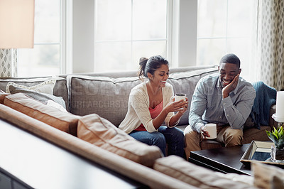 Buy stock photo Couple, coffee and relaxing on sofa in morning for conversation or talk in living room. Discussion, woman and man with smile, happy and married with tea for day plan or romantic date in summer.