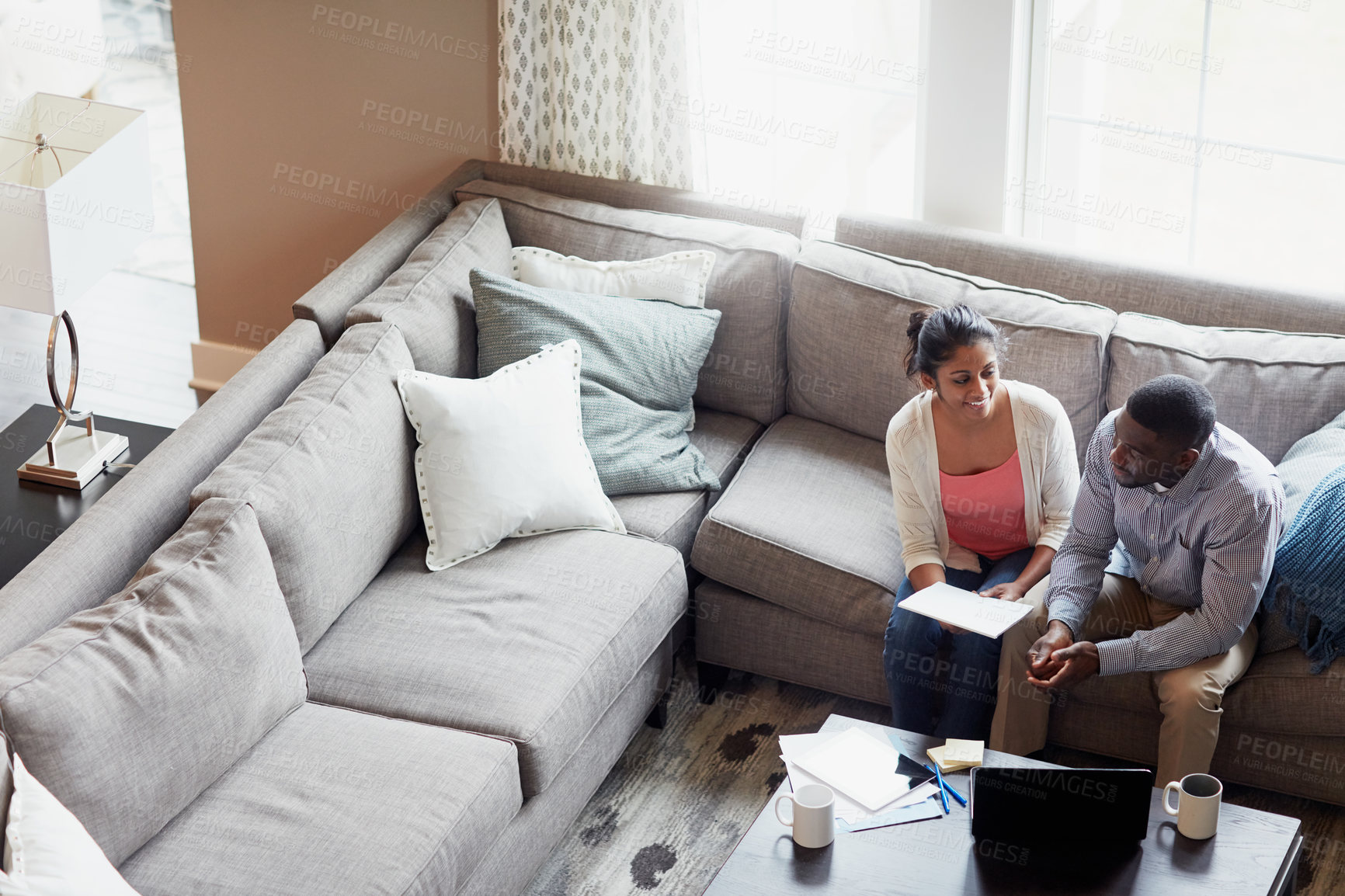 Buy stock photo Browsing, couple and tablet on sofa in morning for work, payments and rent with tax in living room. Technology, coffee and sunlight with people on couch, insurance and finance with debt for mortgage