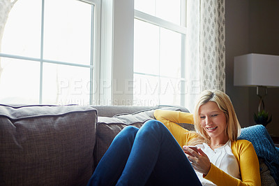 Buy stock photo Happy, reading and woman on couch, phone and rest in living room, morning and social media in house. Relax, calm and girl with mobile, smile or peace in lounge, cozy and person with chat in apartment