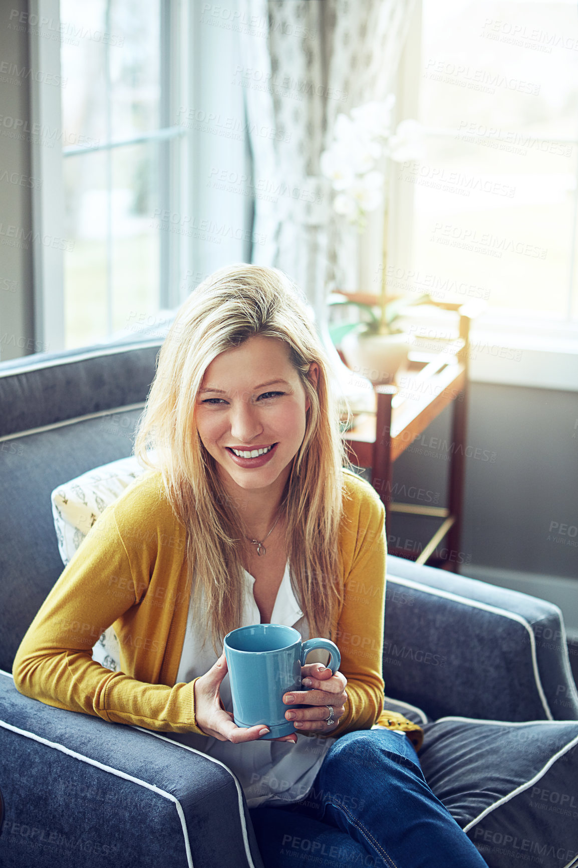 Buy stock photo Woman, armchair and drinking coffee in comfort, relax or break at home with hot beverage. Female person, happy and rest on couch for calm, apartment or peace with happiness in modern house or lounge