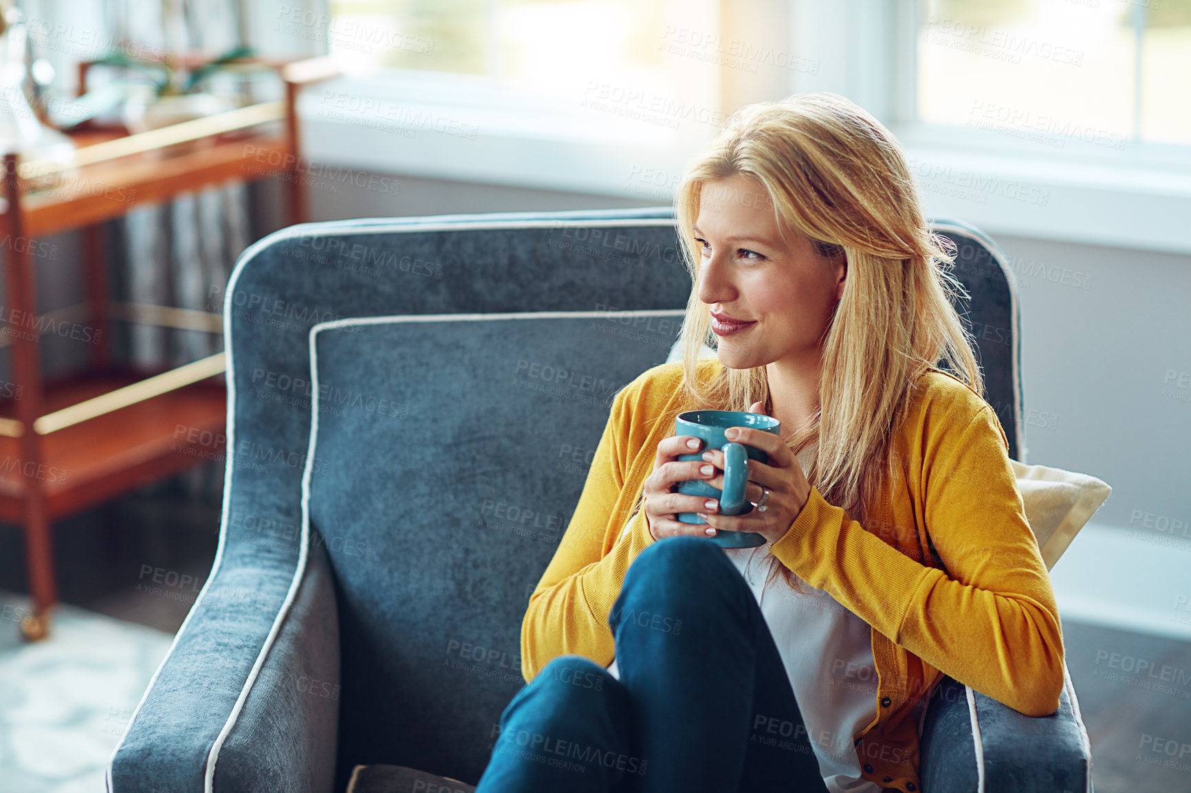 Buy stock photo Home, thinking and woman with coffee, morning and remember in weekend, peace and sofa in living room. House, couch and person with tea, daydreaming and happy for drink in lounge, relax and smile