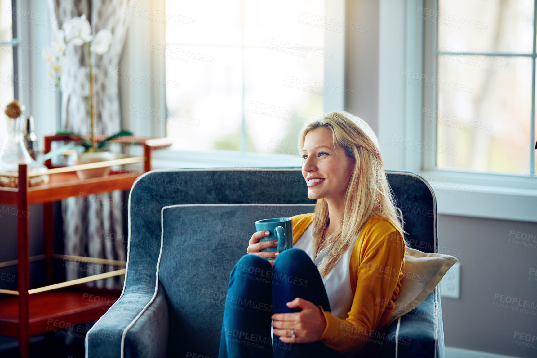 Buy stock photo Home, thinking and woman with coffee, chill and remember in weekend, peace and sofa in living room. House, couch and person with tea, daydreaming and happy for drink in lounge and smile in morning