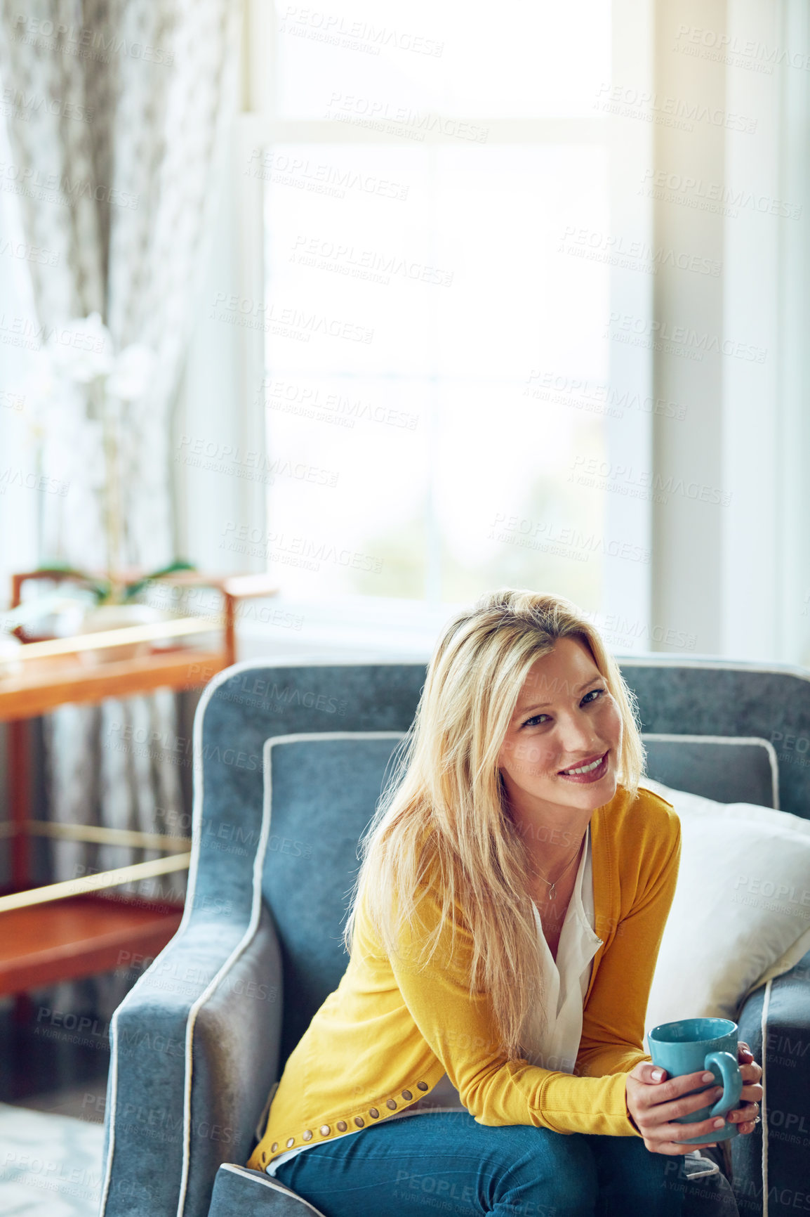 Buy stock photo Portrait, coffee and woman on sofa in home for relax, chill and happy with drink, beverage and cappuccino. Smile, morning and person with cup, tea and mug in living room for wellness, rest and break