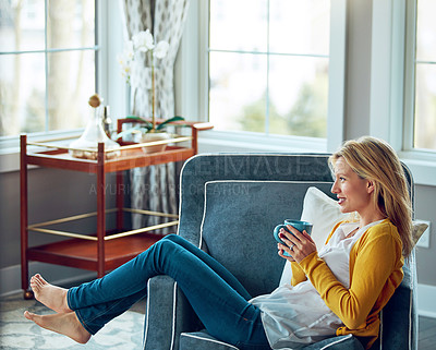 Buy stock photo Thinking, coffee and woman on sofa in home for relaxing, chill and calm with drink, beverage and tea. Smile, happy and person with cup on couch in living room for wellness, rest and break in morning