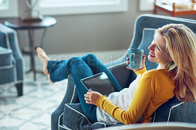 Buy stock photo Happy, tablet and woman on couch, coffee and rest in living room, morning and social media in house. Relax, calm and girl with mobile, smile or peace in lounge, cozy and person with tea in apartment