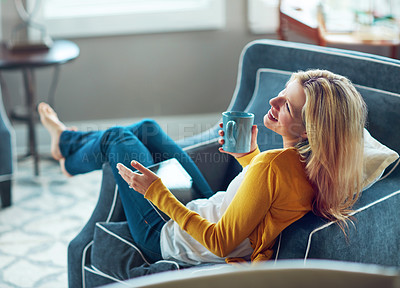 Buy stock photo House, tablet and woman on couch, coffee and rest in living room, morning and happy with social media. Relax, calm and girl with break, smile or peace in lounge, cozy and person with tea in apartment