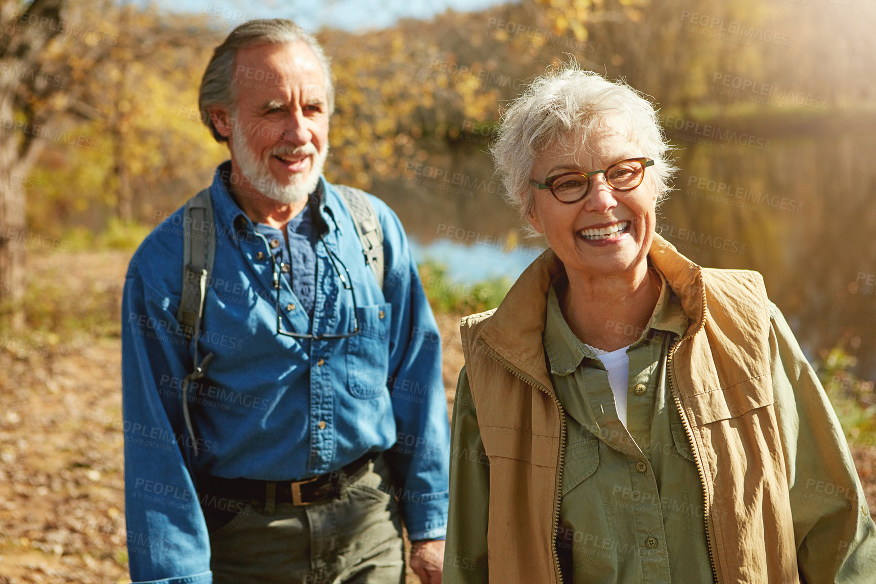 Buy stock photo Shot of a happy senior couple exploring nature together