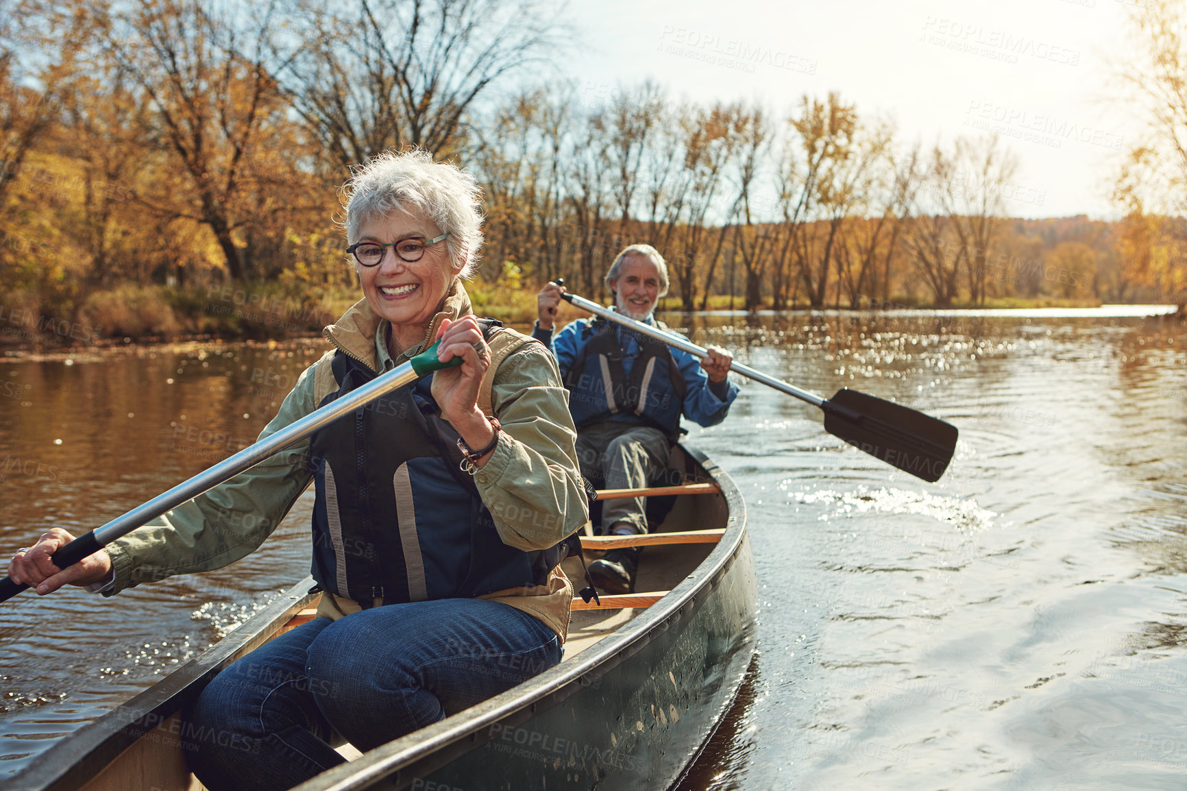 Buy stock photo Lake, rowing and kayak with old couple, nature and retirement with happiness, relax and vacation. Outdoor, river and mature man with senior woman, freedom and trust with holiday and weekend break