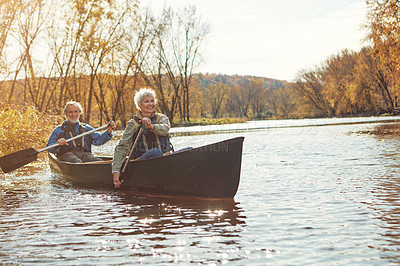 Buy stock photo Lake, rowing and kayak with old couple, water and retirement with happiness, holiday and vacation. Outdoor, river and mature man with senior woman, support and trust with fun, love and weekend break