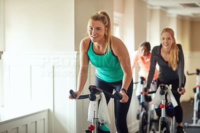 Buy stock photo Woman, exercise bike and gym for performance, training and cycling for fitness or spin class. Female person, riding and stationary machine for workout challenge, aerobic instructor and equipment