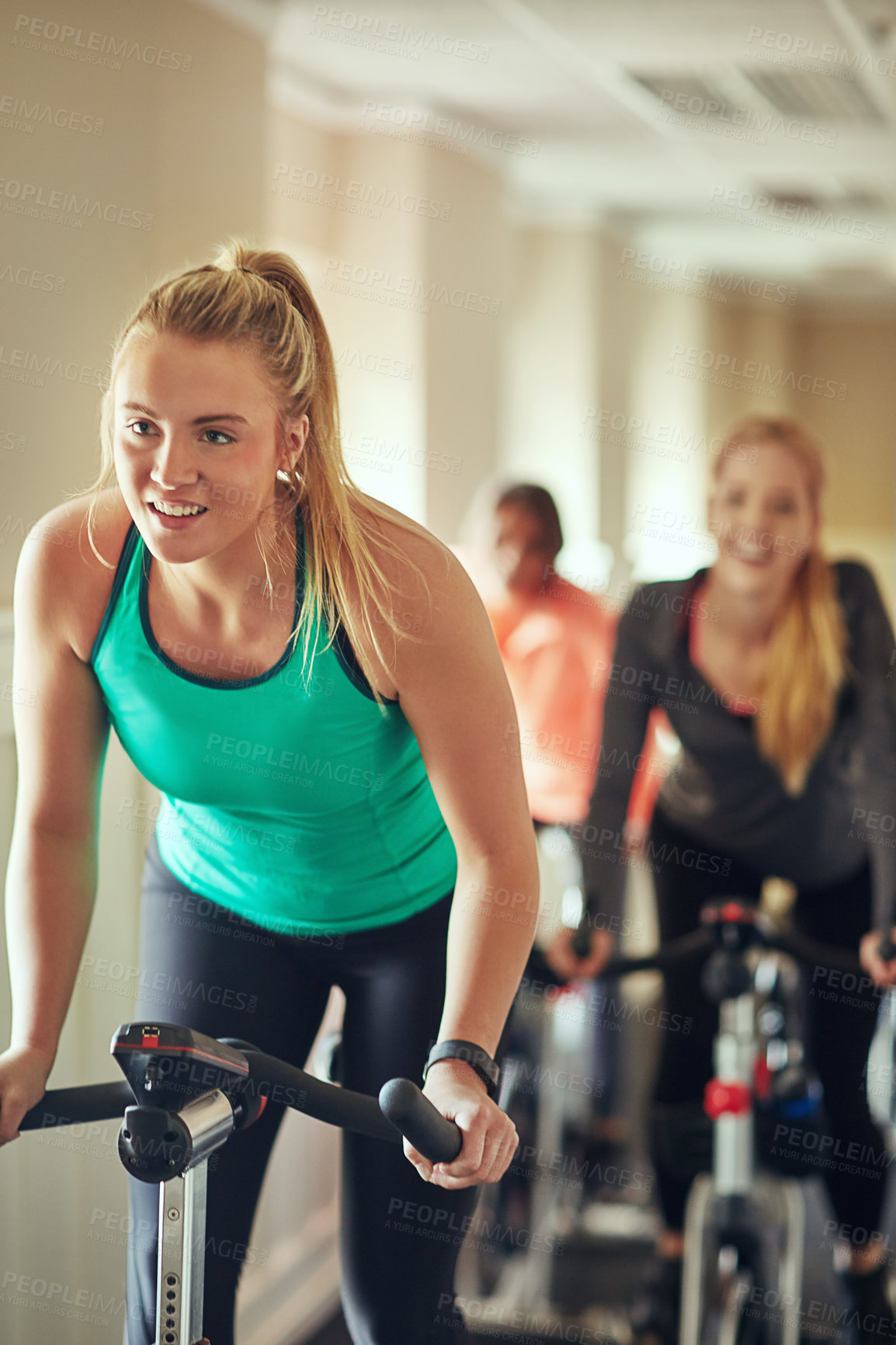 Buy stock photo Woman, exercise bike and gym for action, training and cycling for fitness or spin class. Female person, riding and stationary machine for workout challenge, aerobic instructor and equipment at club