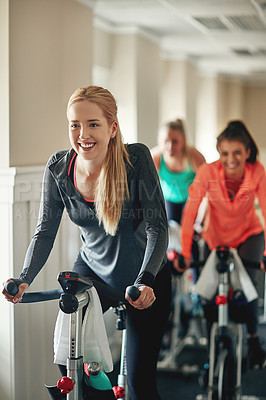 Buy stock photo People, exercise bike and gym class for cardio, training and group for cycling fitness. Women, riding and stationary machine for workout challenge, spinning instructor and equipment for practice