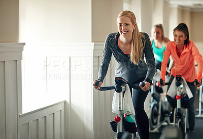 Buy stock photo Woman, spinning bike and class for cardio, training and cycling for fitness together. Female person, riding and stationary machine for workout challenge, aerobic instructor and equipment at gym