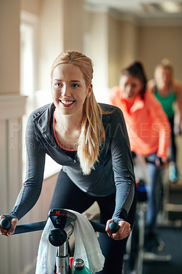 Buy stock photo Woman, exercise bike and class at gym, training and cycling for fitness or spinning studio. Female person, cardio and stationary machine for workout challenge, aerobics instructor and equipment