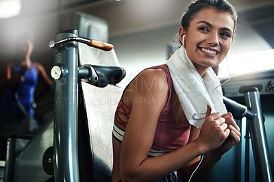 Buy stock photo Gym, towel and woman with smile, fitness break and warm up for intense weight performance. Sport, earphones and female athlete ready for workout, training and chest press exercise for strength