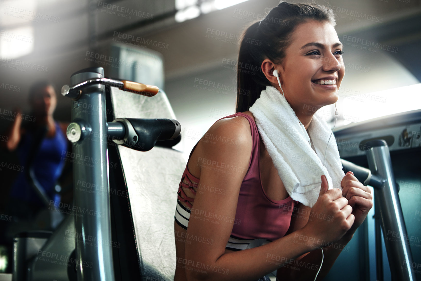 Buy stock photo Gym, towel and woman with smile, workout and warm up break for intense weight performance. Sport, earphones and female athlete ready for fitness, training and chest press exercise for strength