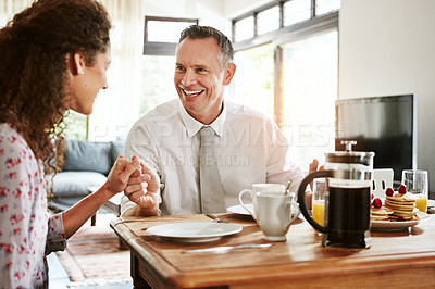 Buy stock photo Shot of a mature couple having breakfast together at home