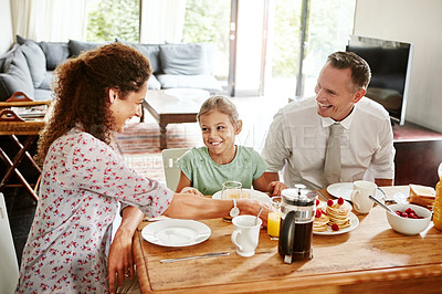 Buy stock photo Shot of a family having breakfast together at home