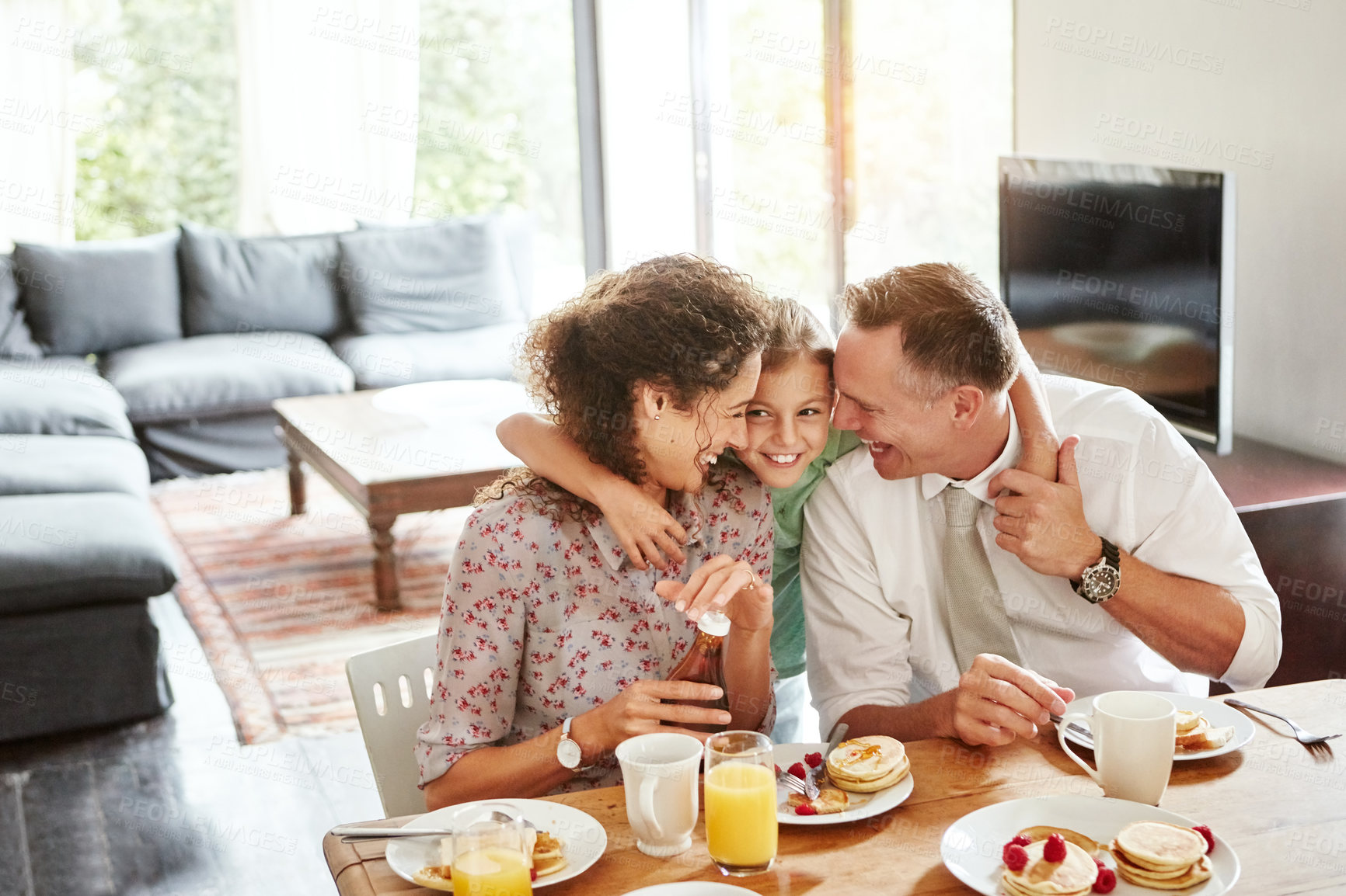 Buy stock photo Shot of a family having breakfast together at home