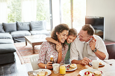 Buy stock photo Shot of a family having breakfast together at home