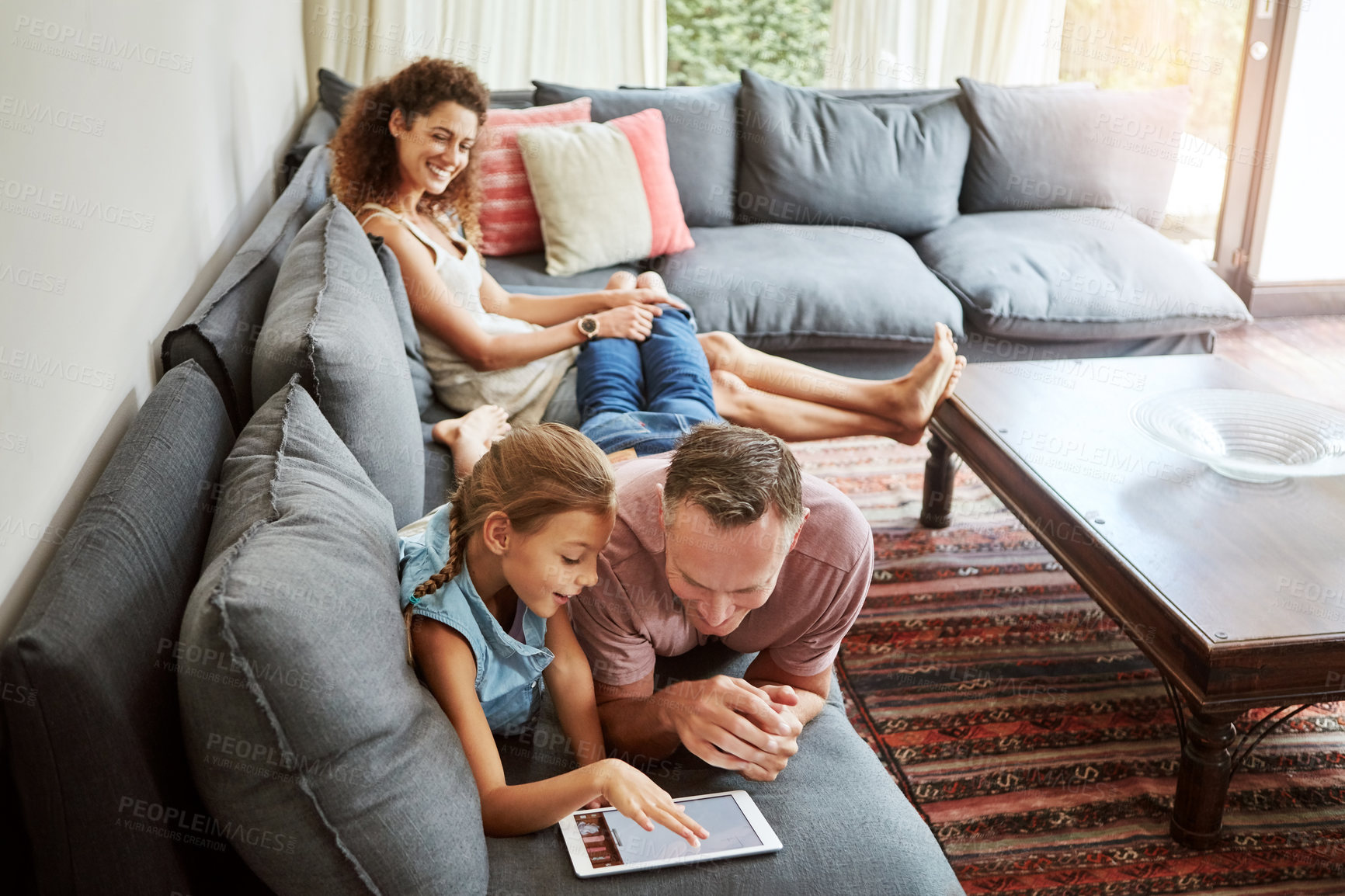 Buy stock photo Family, man and child with tablet in browsing on weekend, break at home for e learning or gaming. Happy people, lounge and relax in together for bonding as parents for growth, development and love