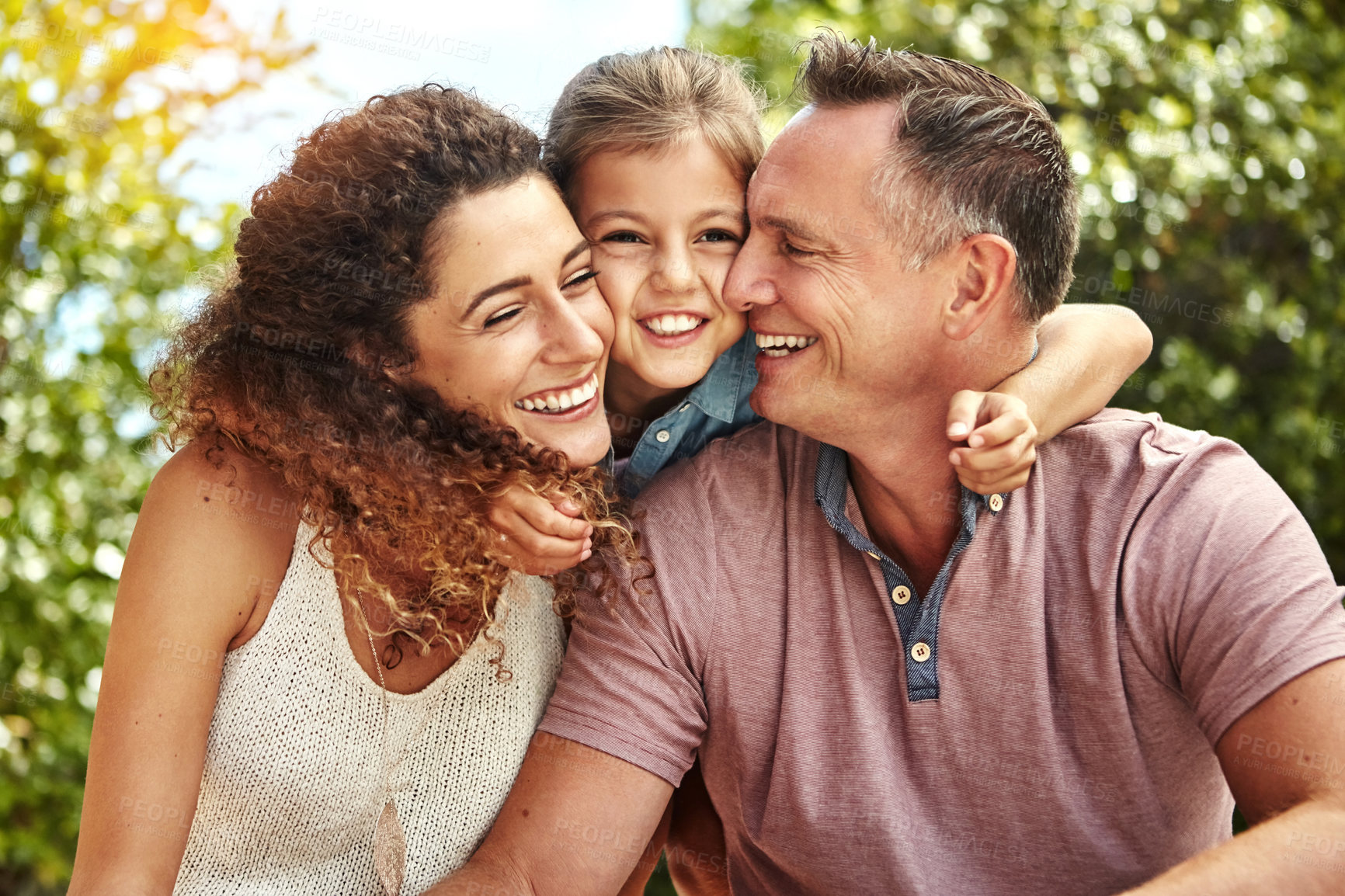 Buy stock photo Smile, family and child hug outdoor with bonding, care or support for security trust at home backyard in summer. Woman, man and girl for embrace moment, love and sunshine vacation of childhood memory