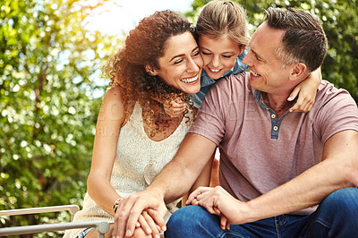 Buy stock photo Shot of a family of three enjoying a day outdoors
