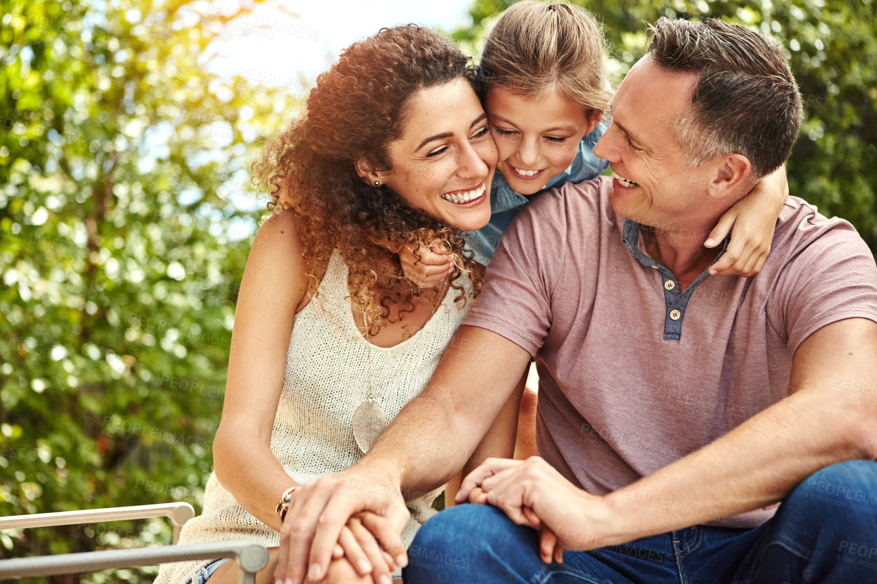 Buy stock photo Family, smile and child hug outdoor with bonding, care or support for security trust at home backyard in summer. Woman, man and girl for embrace moment, love and sunshine vacation of childhood memory