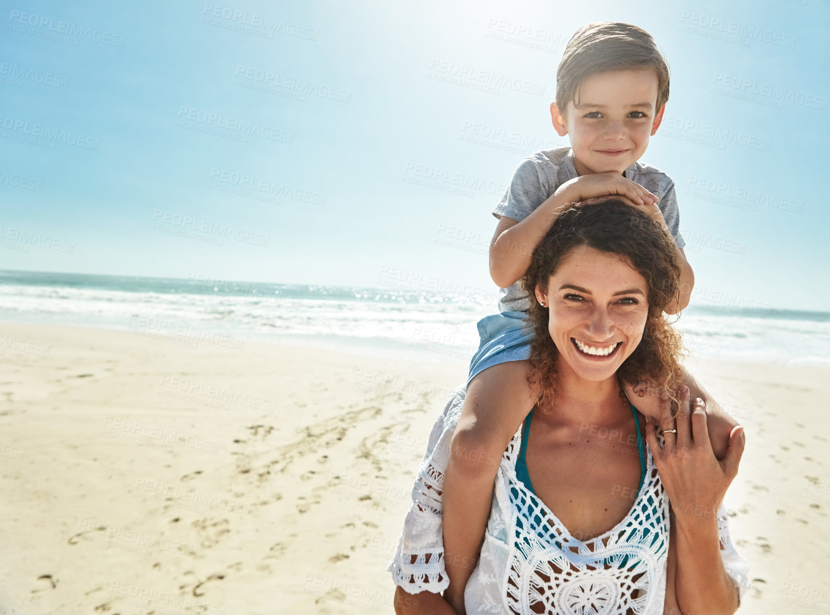 Buy stock photo Portrait of a mother and her little son enjoying some quality time together at the beach