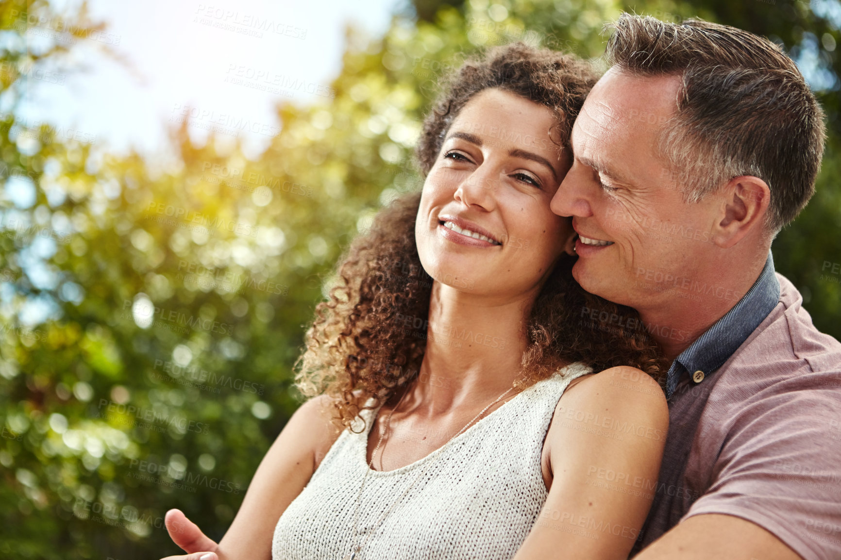 Buy stock photo Smile, couple and hug for marriage bonding with commitment, relationship and connection in backyard. Excited, husband and wife with love embrace for anniversary, time and support together in nature