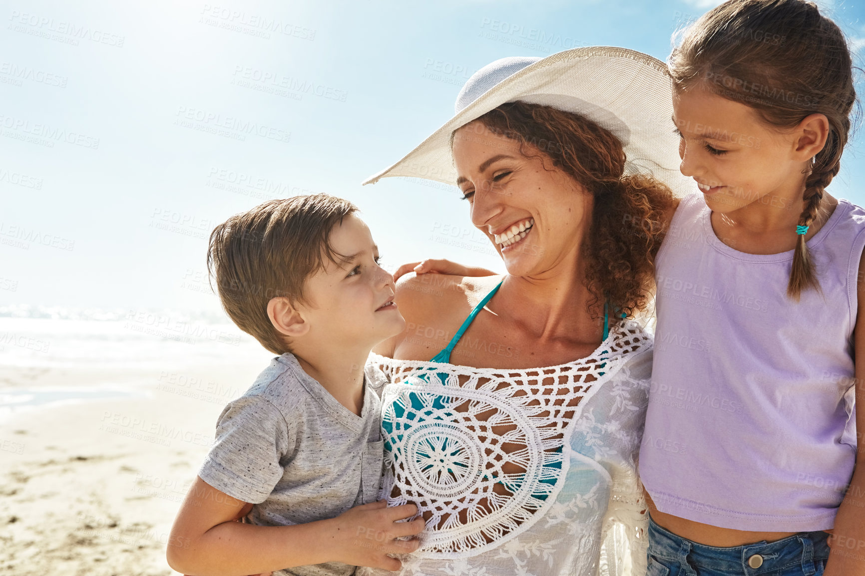 Buy stock photo Beach, family and woman smile for holiday, fun and together with children for Australia adventure. Summer, ocean and vacation afternoon with happy mother, siblings and kids laughing in nature