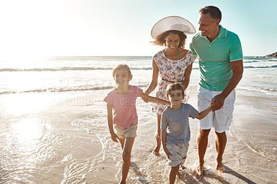 Buy stock photo Beach, family and parents holding hands for vacation, fun and together with children for Australia holiday. People, ocean and adventure afternoon with happy mother, father and kids laughing in nature