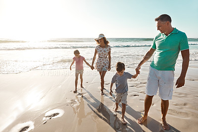 Buy stock photo Parents, children and beach or holding hands for happy summer or travel, ocean sunshine or sibling development. Man, woman and kids on sand for holiday relax walking or outdoor, clean air or vacation