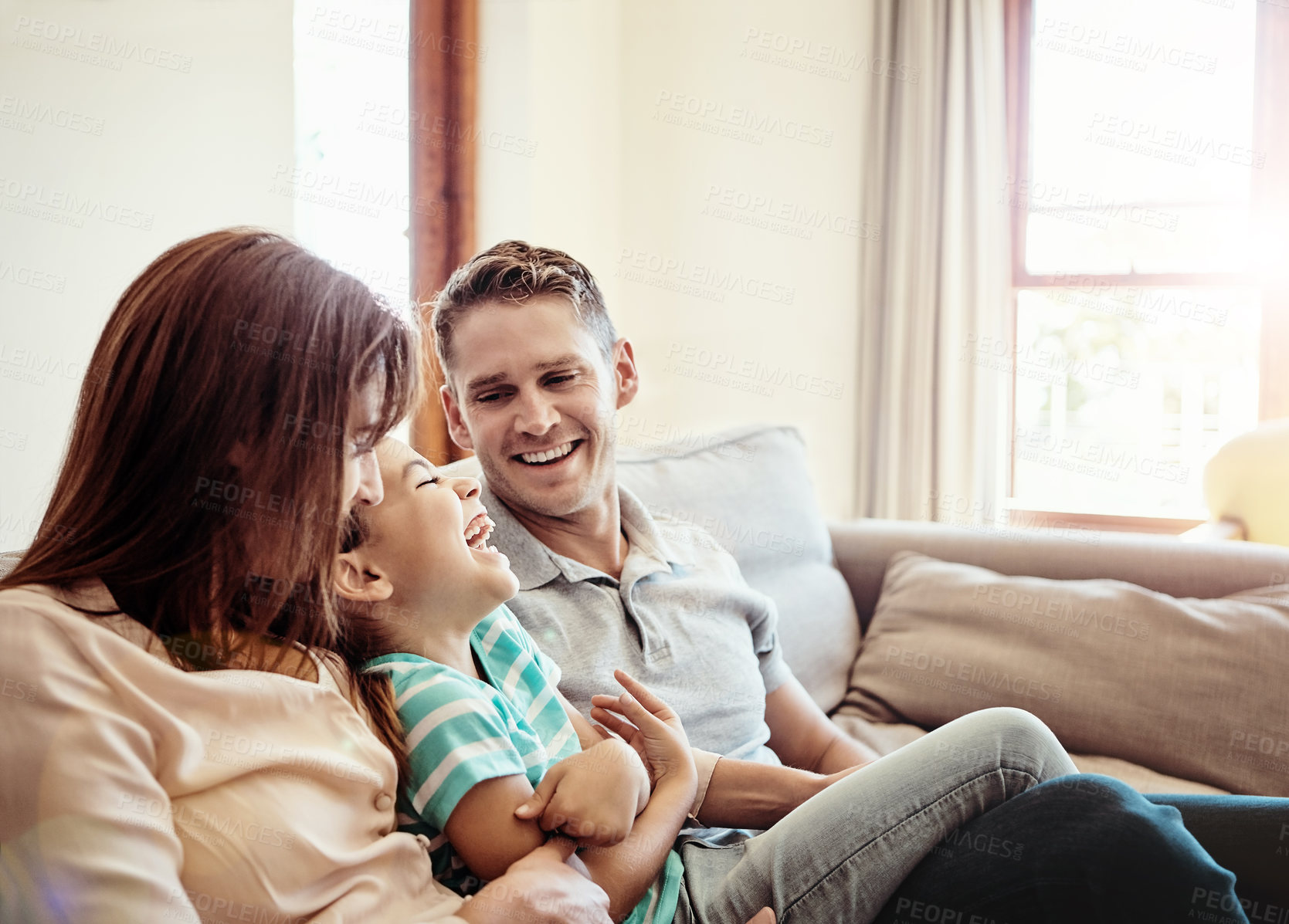 Buy stock photo Shot of a family bonding together at home