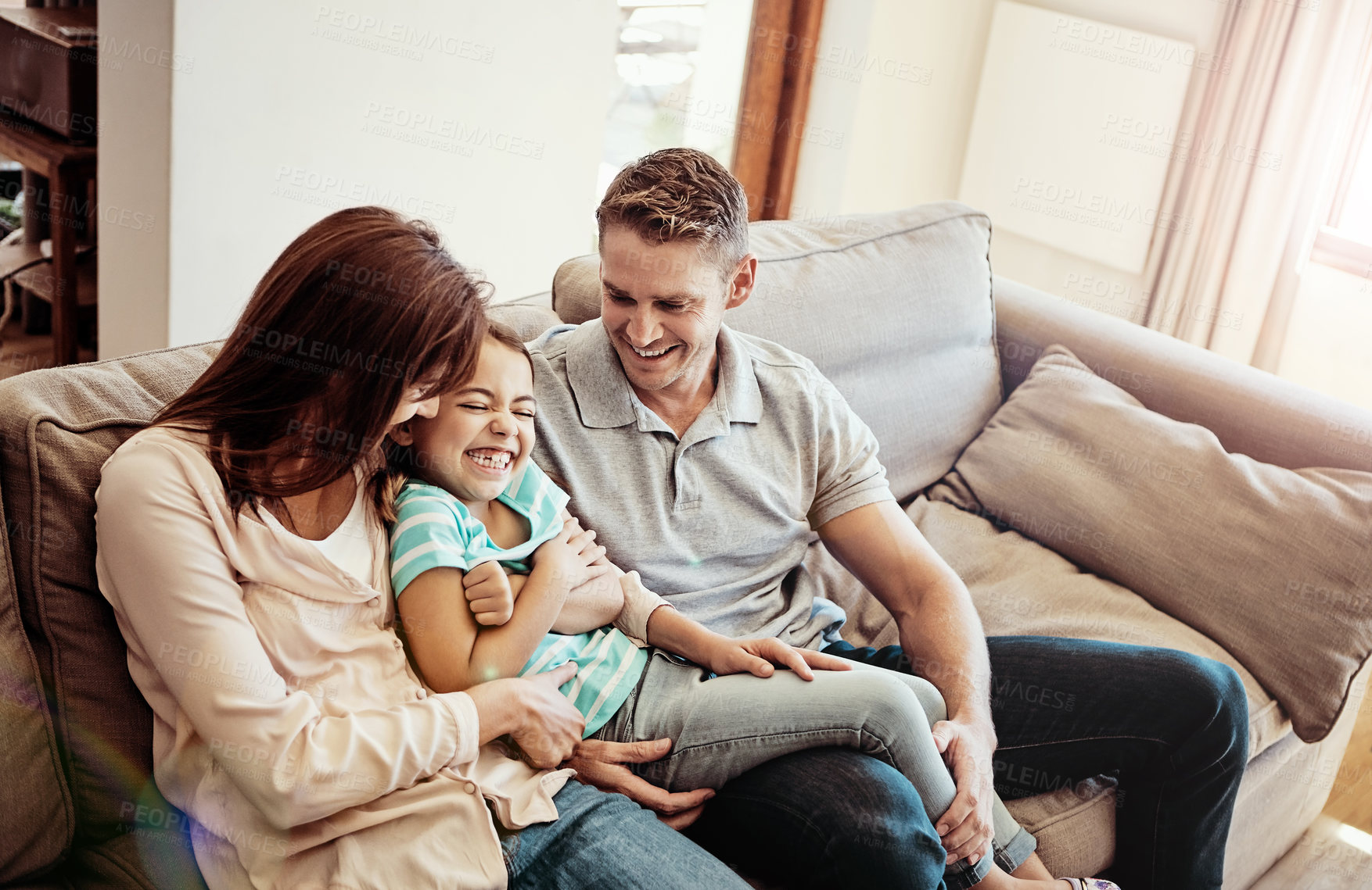 Buy stock photo Shot of a family bonding together at home