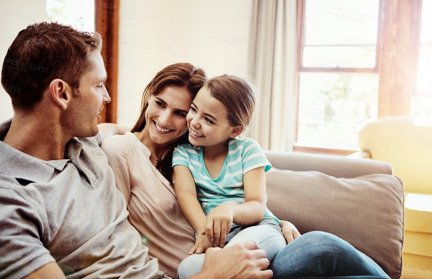 Buy stock photo Shot of a family bonding together at home