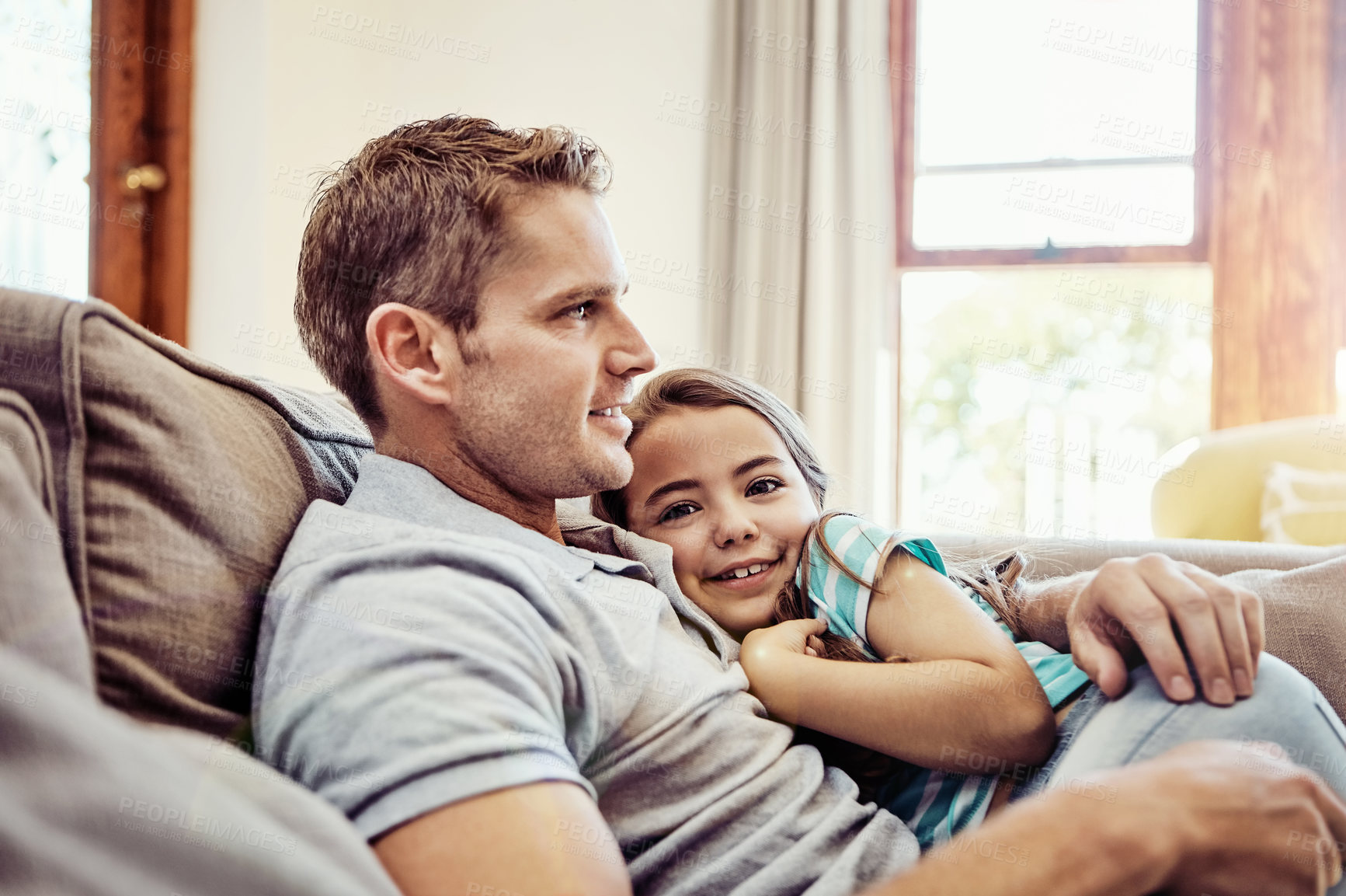 Buy stock photo Shot of a father and his little daughter bonding together at home