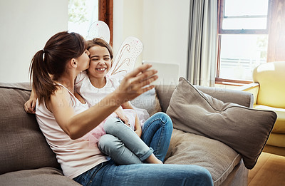 Buy stock photo Mom, girl and smile on selfie on couch for memories, fun and care with support for child development. Parent, kid and happy in living room on sofa for social media, bonding and home with butterfly