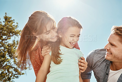 Buy stock photo Shot of a family bonding together outdoors