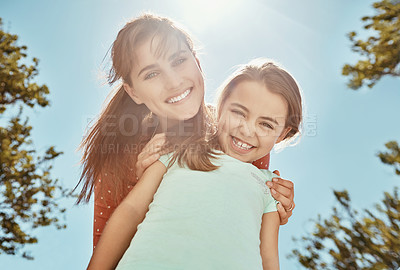 Buy stock photo Portrait of a mother and her little daughter bonding together outdoors