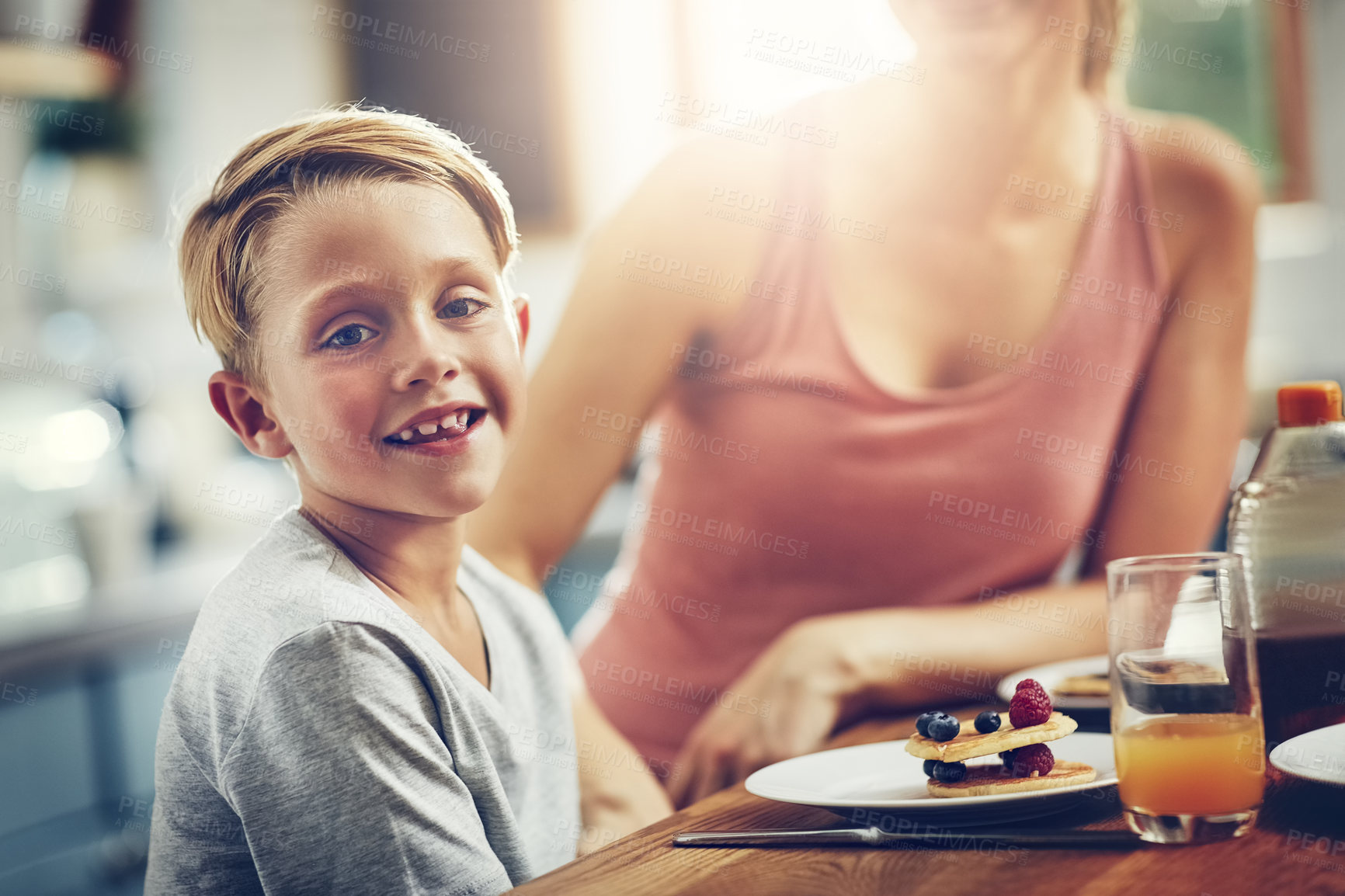 Buy stock photo Cropped shot of a little boy having breakfast at home