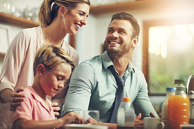 Buy stock photo Home, parents and boy with breakfast, food and happiness in kitchen, bonding together and smile. Family, mother and father with kid, healthy meal and hungry with nutrition, wellness or care in house