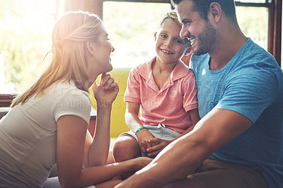 Buy stock photo Shot of a family of three spending some quality time at home